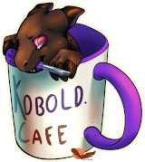 Un petit kobold marron dans une tasse avec marquée Kobold Café